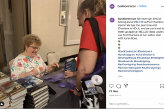 Charlaine Harris signs a book for a fan