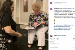 Charlaine Harris signs a book for a fan