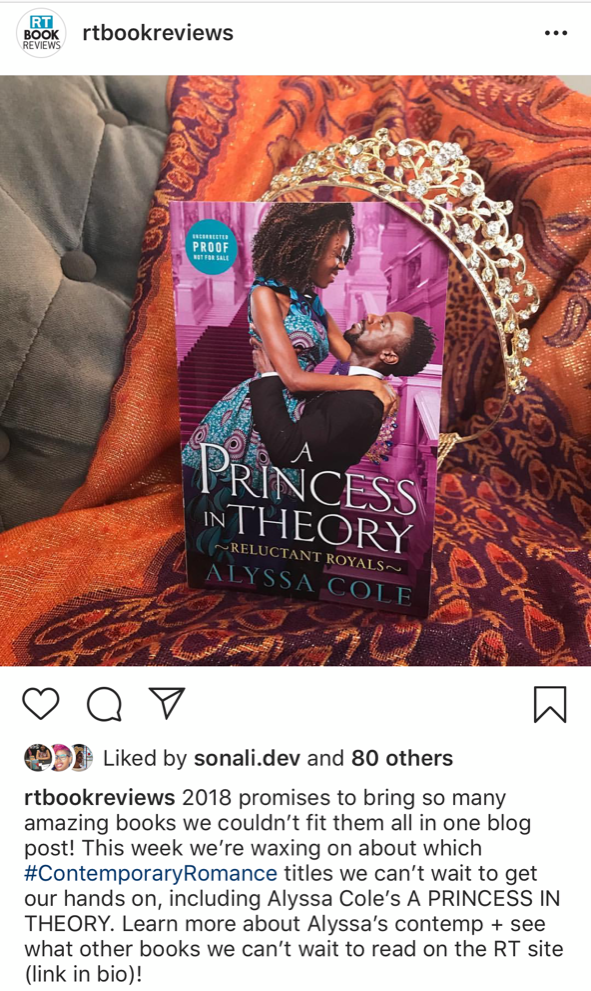 A screenshot features a photo of Alyssa Cole's A Princess in Theory with a tiara balanced on top of the book.