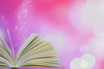 An open book shows sparkles coming up off the pages.